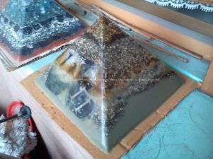 the beeswax orgonite pyramid for web radio 11:11 in all its shine