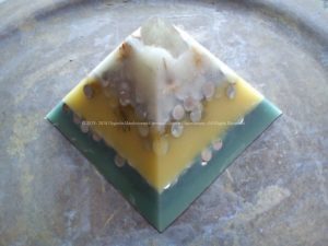 Pyramid orgonite 12 with a big hyalin quartz on top and a big shungit on the heart.