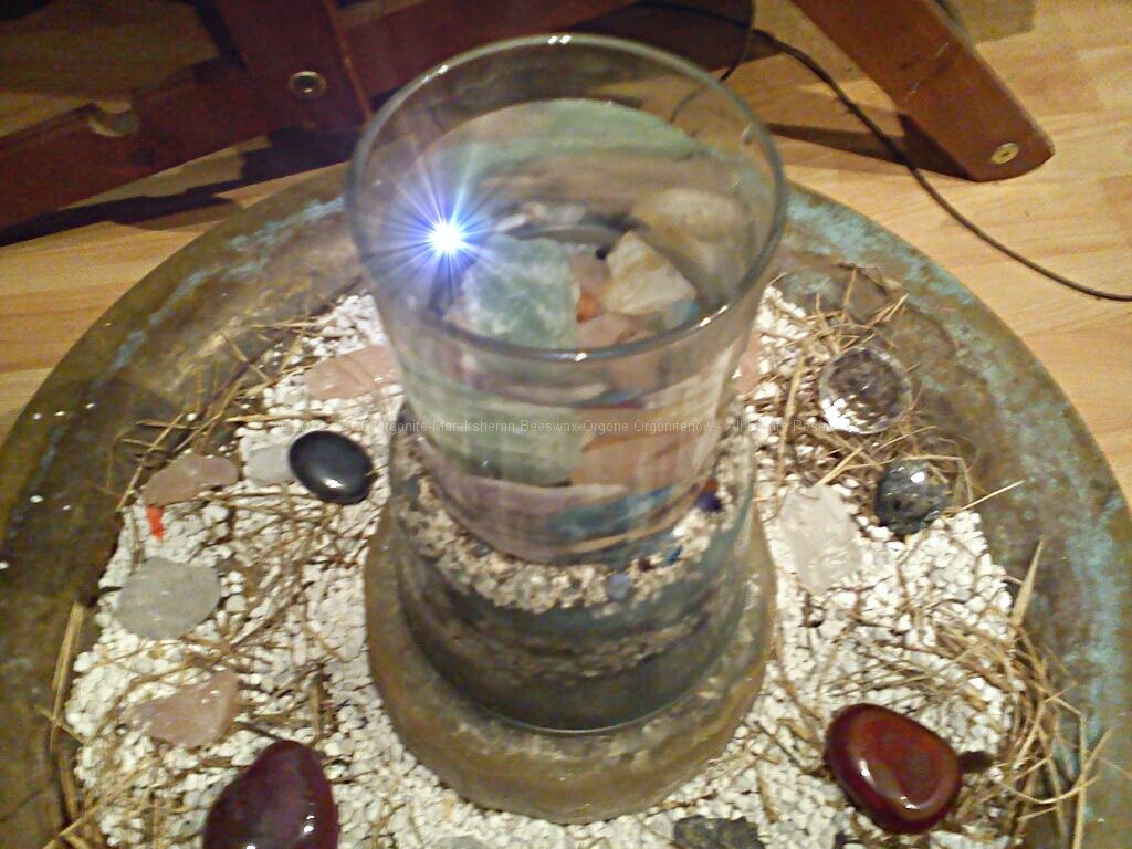 Glass of water with crystals to rest on beeswax orgonite (modifyed image)