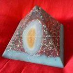 Pyramid orgonite, with beeswax, laser quartz on top, heart of worked shungite, an agata external.