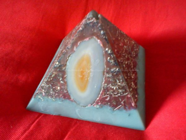 Pyramid orgonite, with beeswax, laser quartz on top, heart of worked shungite, an agata external.