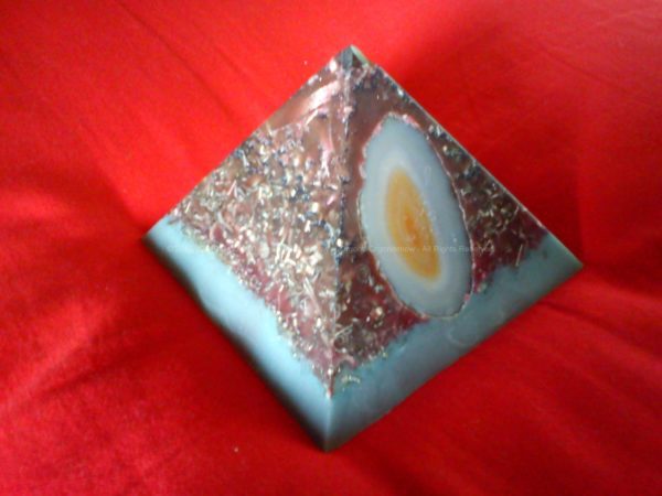 Pyramid orgonite, with beeswax, laser quartz on top, heart of worked shungite, an agata external.