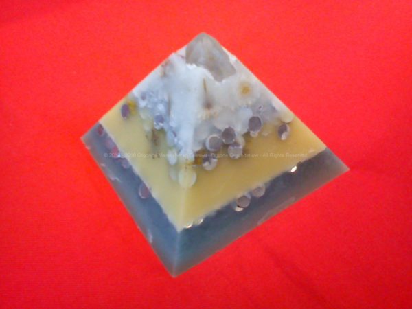 Pyramid orgonite with a huge laser quartz, flowers, beeswax and metals, and russian shungit