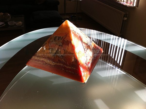 Crystal Cave Pyramid Orgonite 24 cm, beeswax and metals, quartz and selenit as rain, huge hematite inside