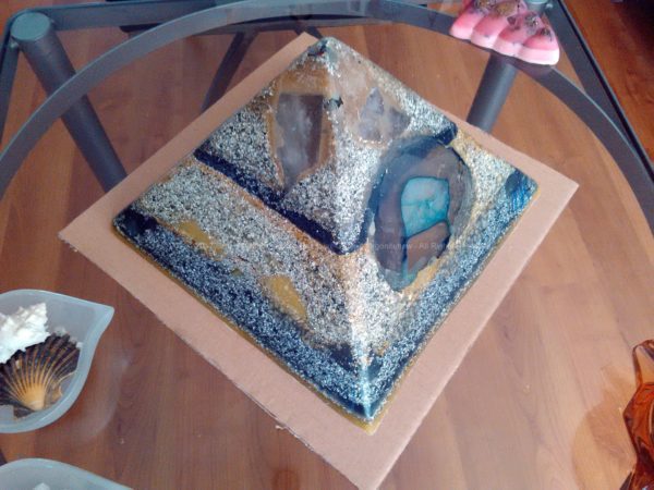 Black Celebration 24 cm pyramid orgonite, Rock crystal, smokey quartz, agata, rose quartz, fluorit, other minerals, beeswax and metals.