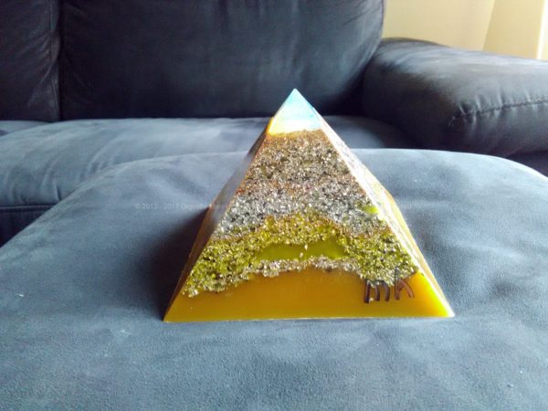 Adriatico, 12 cm pyramid orgonite done with an opalite pyramid, blue apatite beeswax and metals, plus one piece of shungite under the pyramid.
