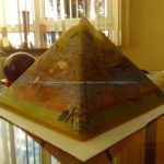 Hydra 24 cm pyramid orgonite, several huge rock quartz, a quartz sphere, shungite, beeswax and metals, glass.