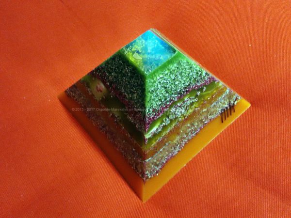 Tirreno, 12 cm pyramid orgonite done with an opalite pyramid, blue apatite beeswax and metals, plus one piece of shungite under the pyramid.