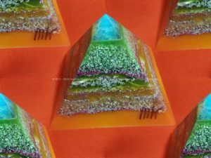 Tirreno, 12 cm pyramid orgonite done with an opalite pyramid, blue apatite beeswax and metals, plus one piece of shungite under the pyramid.